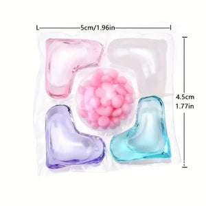 Colorful silicone heart-shaped molds with measurements on a white background
