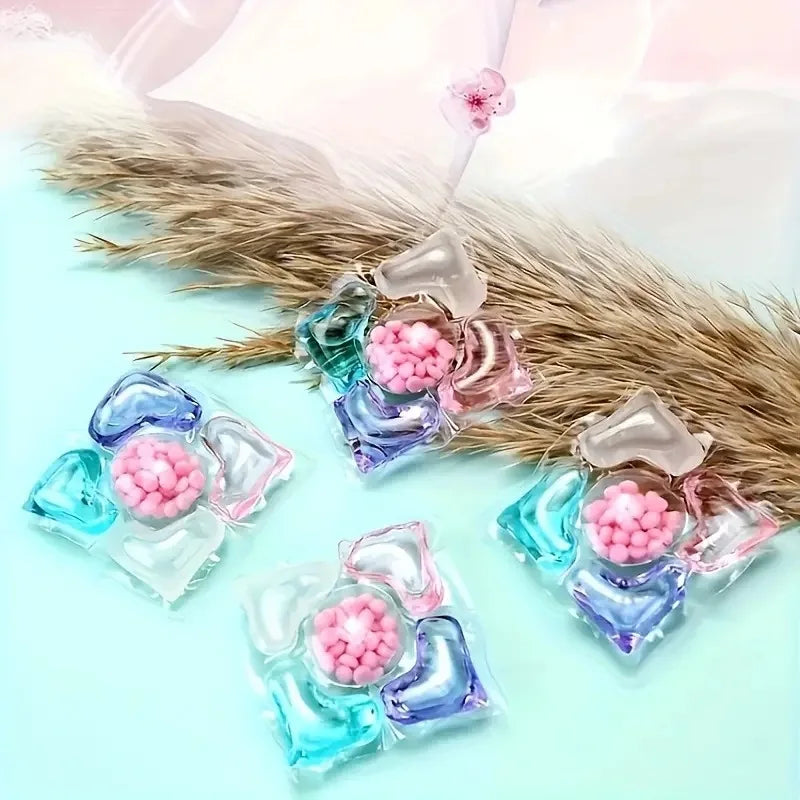 Colorful jelly-like candies with pink centers on a light blue background