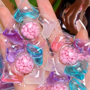 Colorful jelly candies in clear plastic packaging held by hands.